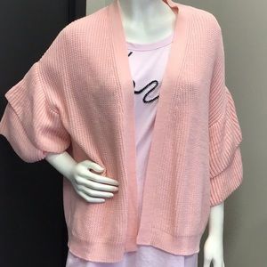 Pink sweater with ruffle sleeves